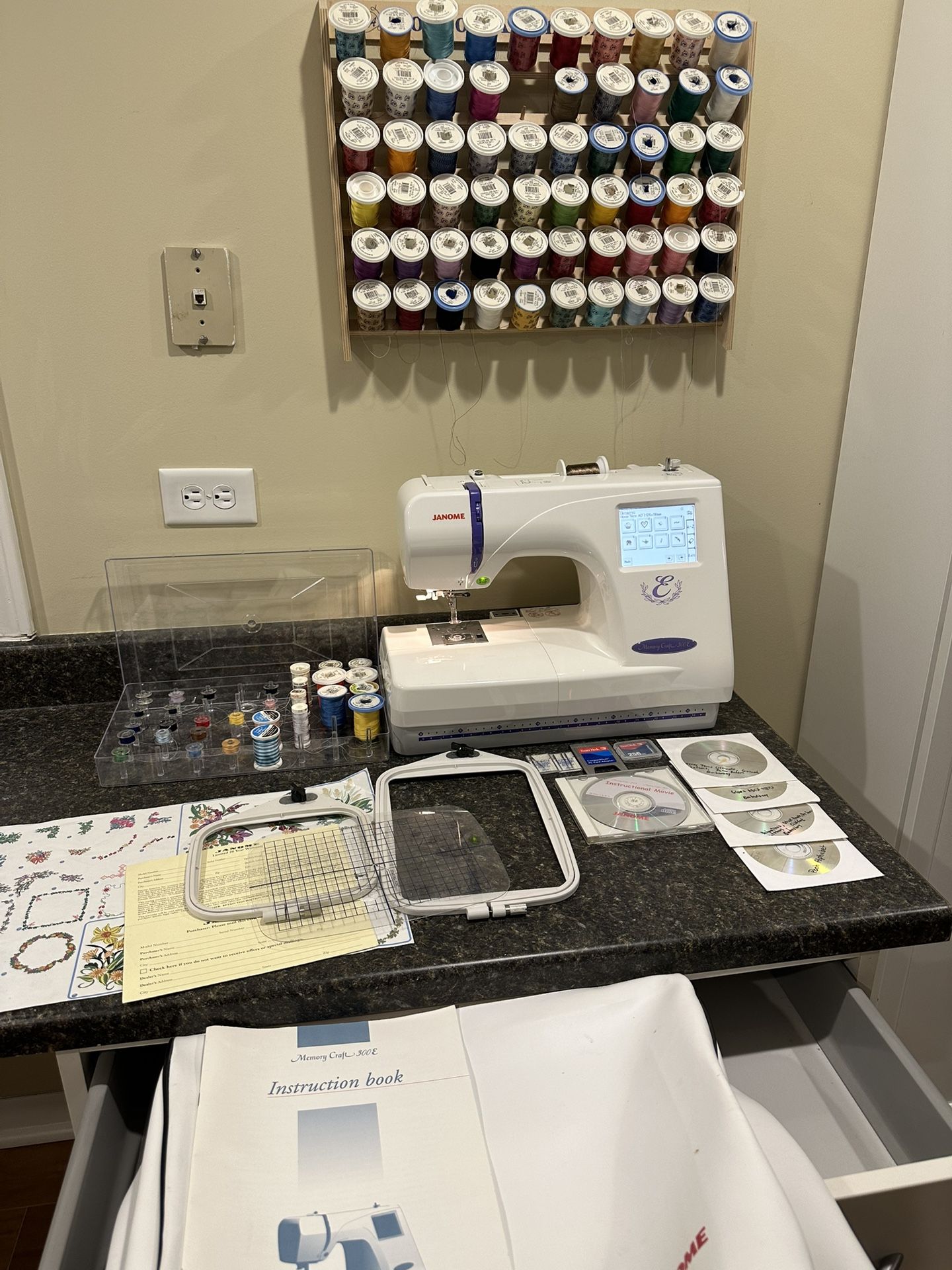 JANOME MEMORY CRAFT 300E EMBROIDERY MACHINE - 3 hoops, new in box giga hoop, FILLED thread rack