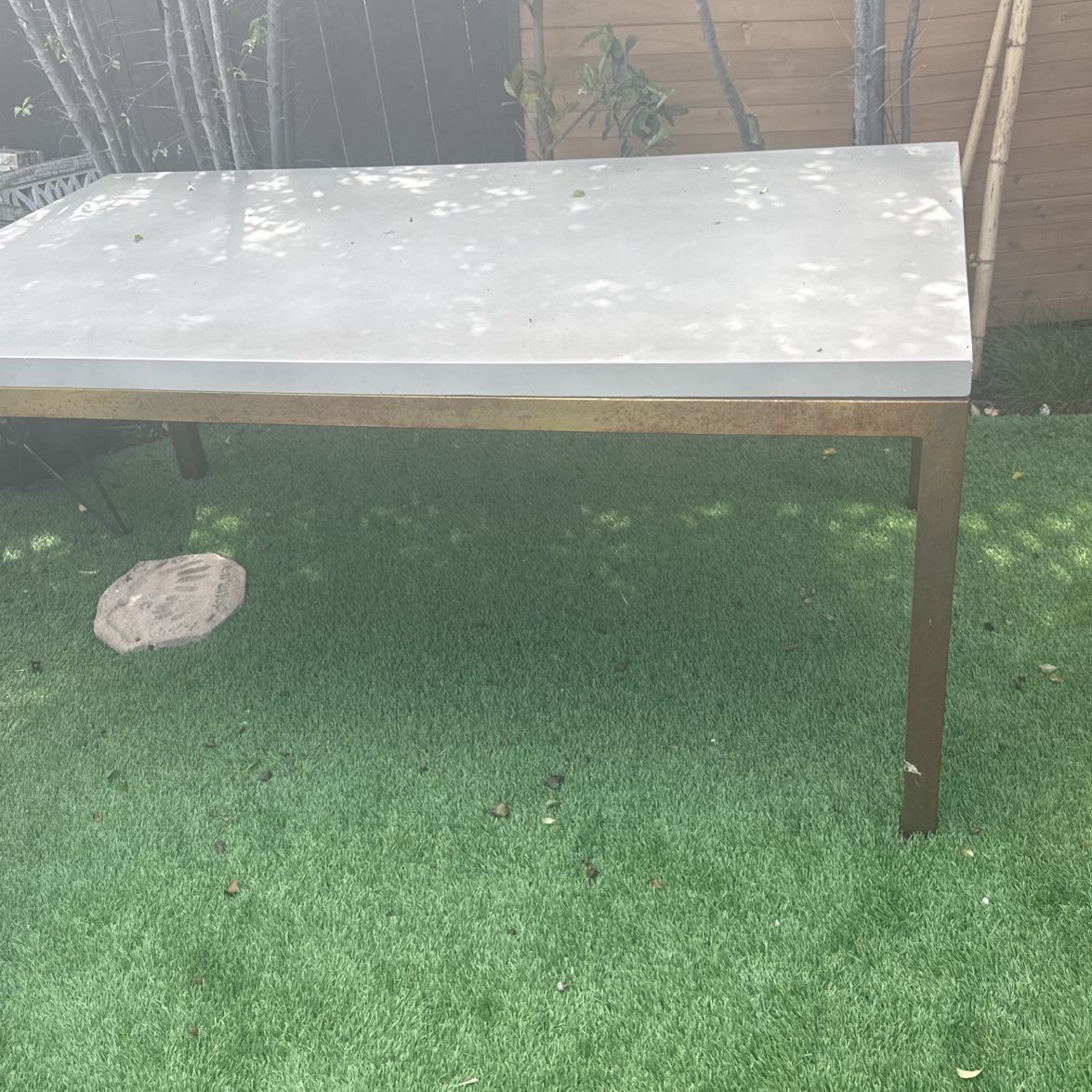 Concrete And Brass Dining Table And Leather Chairs