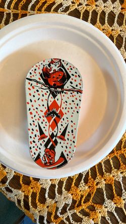 Spinning , tin Halloween noise maker