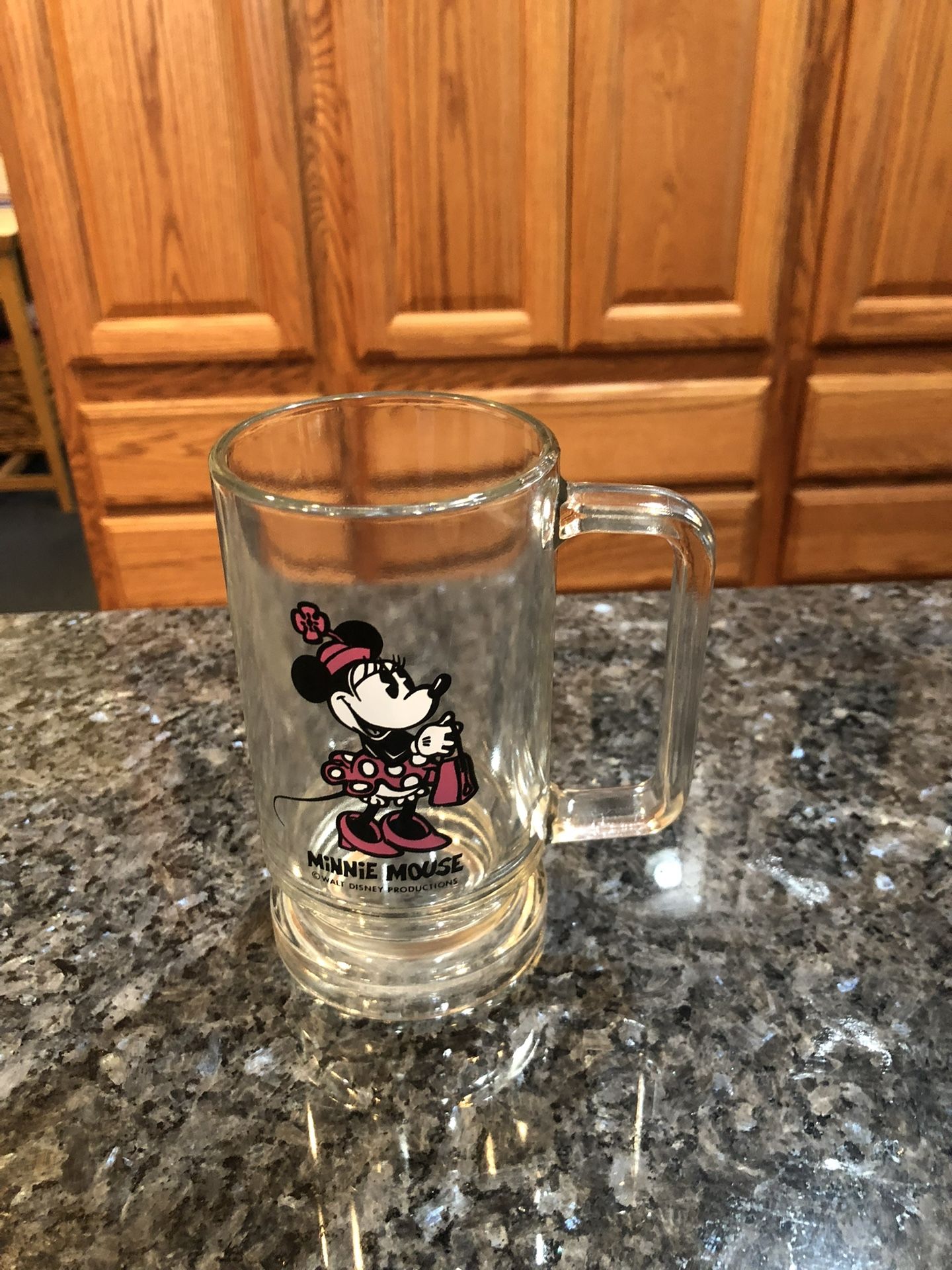 Vintage Disney Minnie Mouse Clear Glass Mug.  Size 5 1/2 inches tall.  Preowned good condition.  Has been on display in a cabinet with a Disney collec