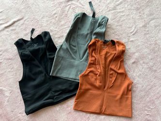 Urban Outfitters out from under 3 pack of low cut crop top shirts *very cute/tight)