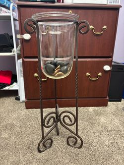 Iron stand with glass vase