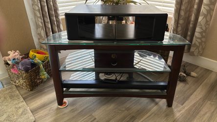 Glass and wood TV stand with shelves