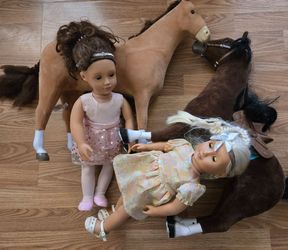 2 18" Dolls and 2 Horses Dolls have outfits and shows.