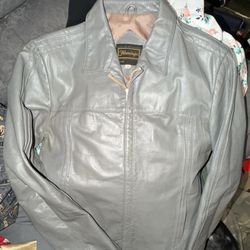 vintage gray mens size 40 leather jacket by Flamingo, as Based on its style-featuring a structured collar, zippered front, and a characteristic 80s/90