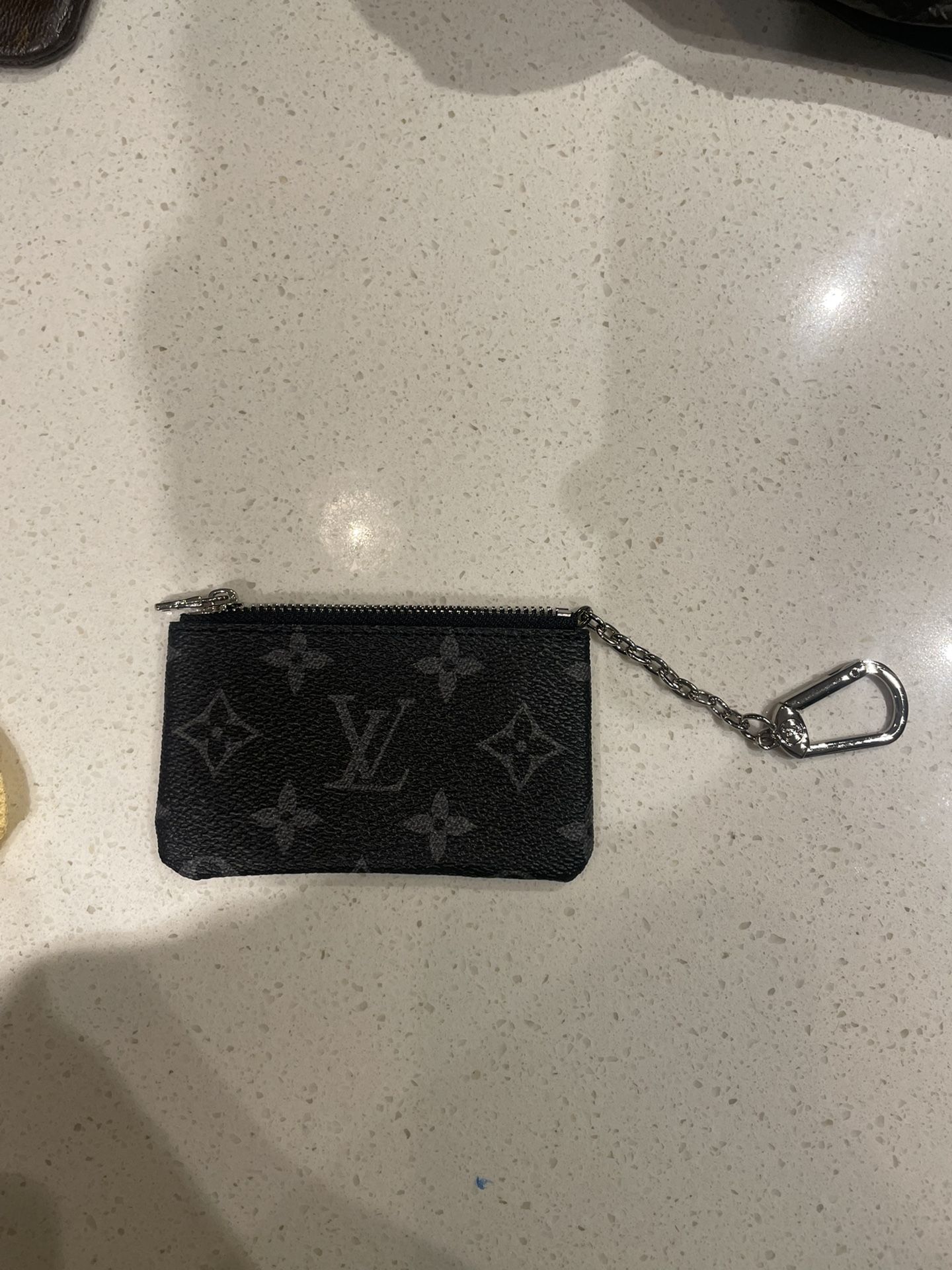 LV Coin Pouch $60