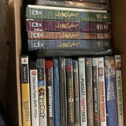 Box Of DVDs And Video Games In Original cases 