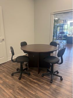 Wooden round table with chairs