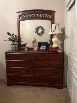 Chest of drawers with mirror.