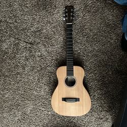 A Guitar 🎸 The Brand Is Martin And Go