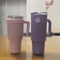 pink and purple tumbler cups/stanley cups 