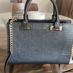 Michael Kors black and gold handbag