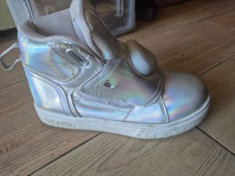 pair of Shoe Beatz pearlescent silver holographic high-top sneakers