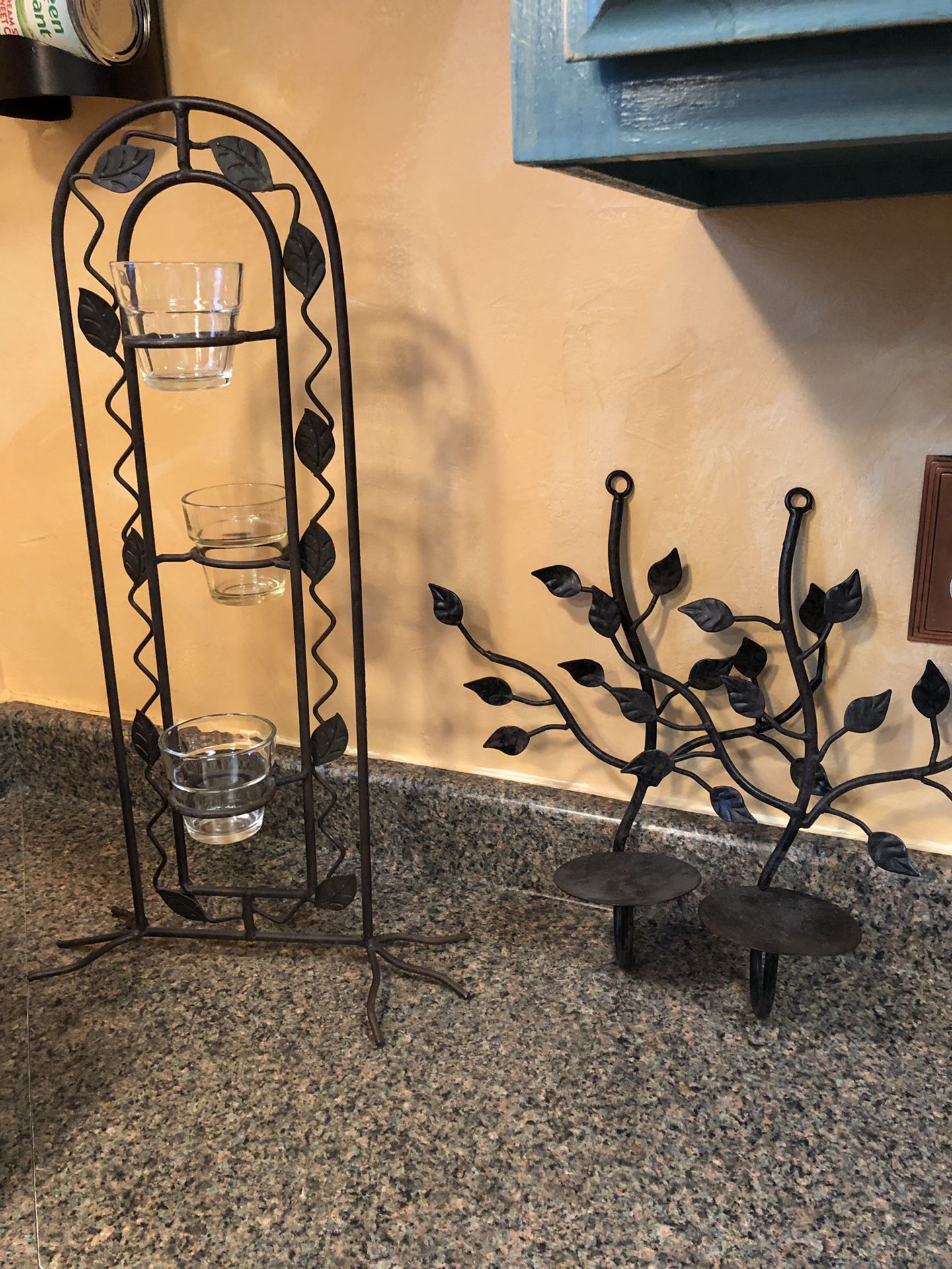 Pair of wall sconces and votive candle holder.