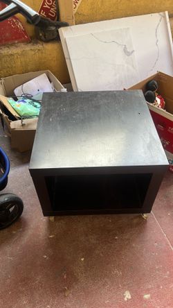 Black IKEA table on casters