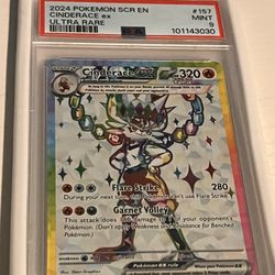 Pokémon cards and a PSA slab