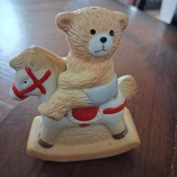 Vintage ceramic teddy bear on a rocking horse salt and pepper shaker set. 
