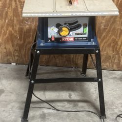 Ryobi Table Saw BTS12S Saw Snd Stand. Used in good condition with some cosmetic blemishes. These blemishes are in the form of scratches and scuff mark