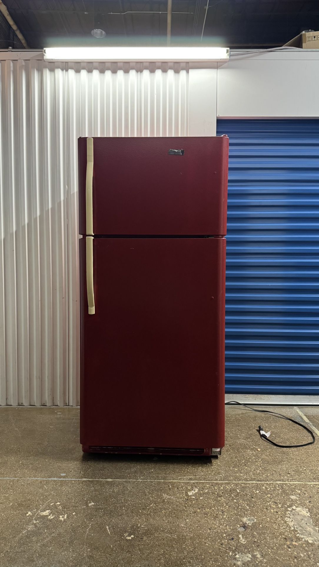 painted refrigerator, burnt red exterior and aqua blue interior