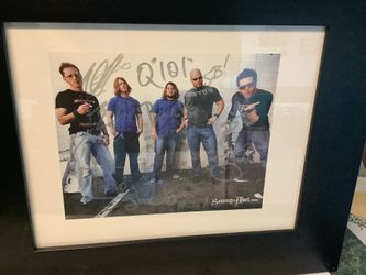 the band Savage Abel as indicated. The photograph is signed by band band members and professionally framed