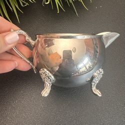 Elegant Silver coated Creamer with Ornate Handle