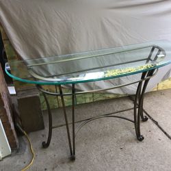 Glass and brass sofa table.