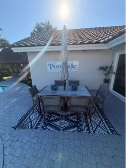 Outdoor Ocean tide table with 9ft tall tilt umbrella with base