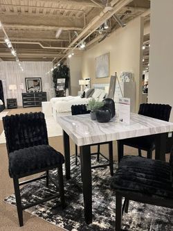 Contemporary design counter height dining set featuring a two-tone marble look top