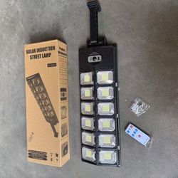 New In Box 24x7 Inch Solar Panel LED Wall Mounted Street Light Motion Sensor Security Lighting With Remote Controller 