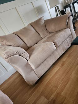 Tan couch and love seat