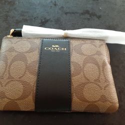 BRAND NEW COACH Monogram Canvas Corner Zip Wristlet.
Retails for $99