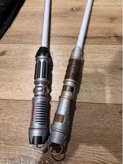 2 authentic Star Wars lightsabers from Disneyland/Star Wars: Galaxy’s Edge.