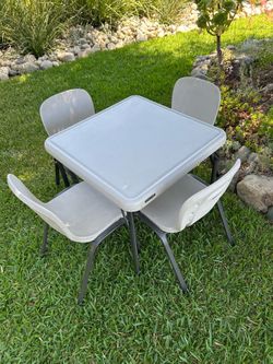 Children’s table with four chairs