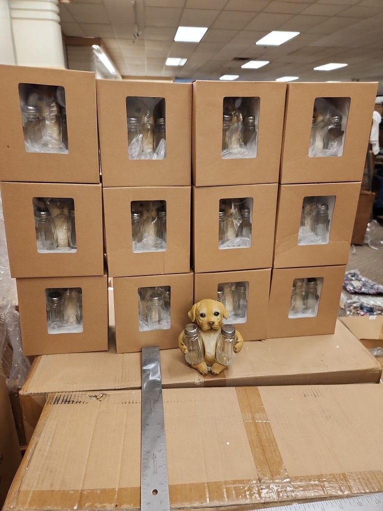 Case of 12 new Labrador holding salt and pepper shakers.