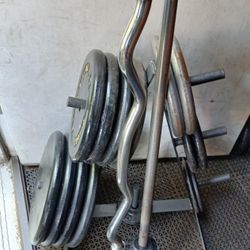 Standard weights set plates with Crul bar, Barbell and Weight tree.