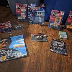 Dale Earnhardt Nascar's collection set 6 medium size car's one figurine  one book one small pitcrew and a pack of playing cards still in the plastic n