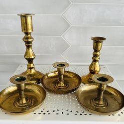 Set of 5 vintage Korea brass candle Stick holders  7 1/4” tall x 3 1/4” across bottom , 5” tall x 3” across bottom,  3 are approx 2 3/4” tall x 4 1/2”