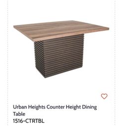 Urban Heights Counter Height Dining Table with one leaf.