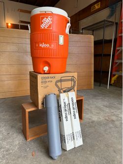 Igloo water cooler with bracket, cups, and cup dispenser