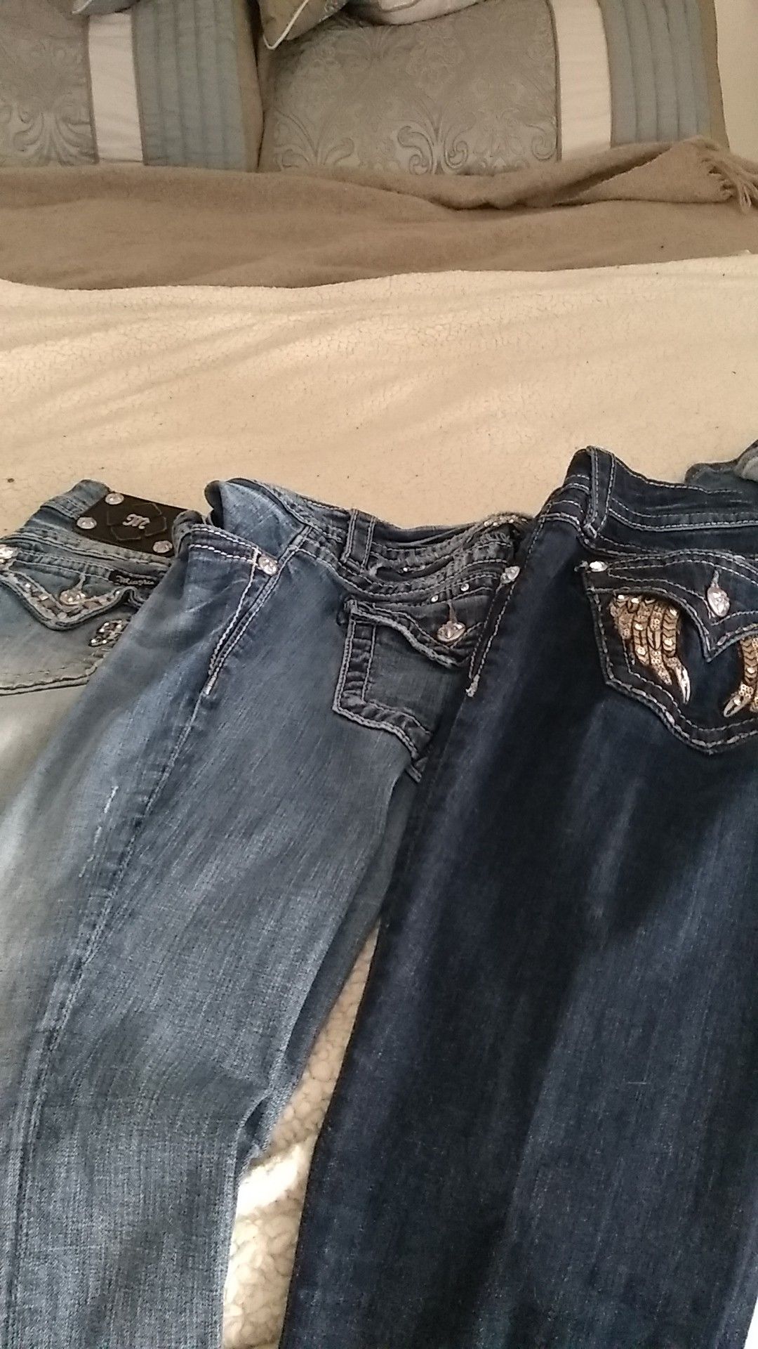 Three pair of Miss me jeans and good condition two pair long and one pair is capris size 25 one pair is 40 and the other two pair are 25 each