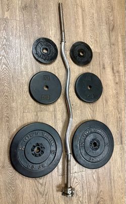 Standard Curl Bar with Cast Iron Weight plates: 25s, 10a and 5s. Total: 97 lbs