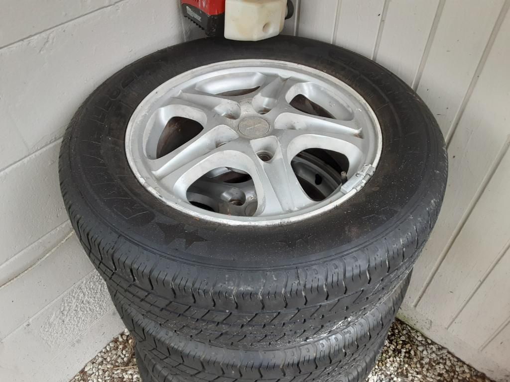 4 Tires like new , with rims 5 lugs