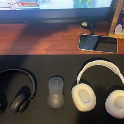 2 Headphones And A Logitech Mouse
