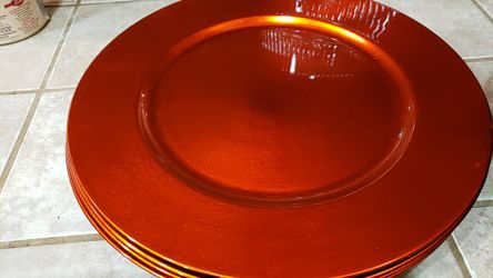 Orange plate chargers and bowl