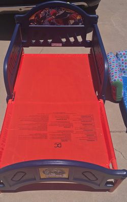 Toddler spiders an bed frame
