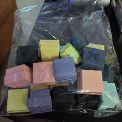 Bag of bow boxes  Good for earrings or rings around 25 included