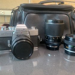 Beautiful Minolta SRT-202 Camera with a 50mm f1.7, 28mm f2.8, & 135mm f2.8 Lens