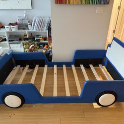 Must Sell Like New Twin Size Race Car Bed (Excludes Mattress)