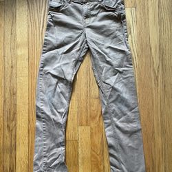 This is a pair of H&M children's casual trousers, often referred to as Chinos or twill cotton pants. • Brand: H&M • Size: The label indicates EUR 134,