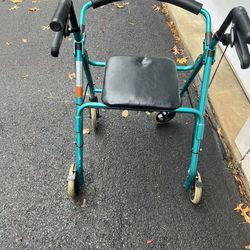 Elderly walker with seat